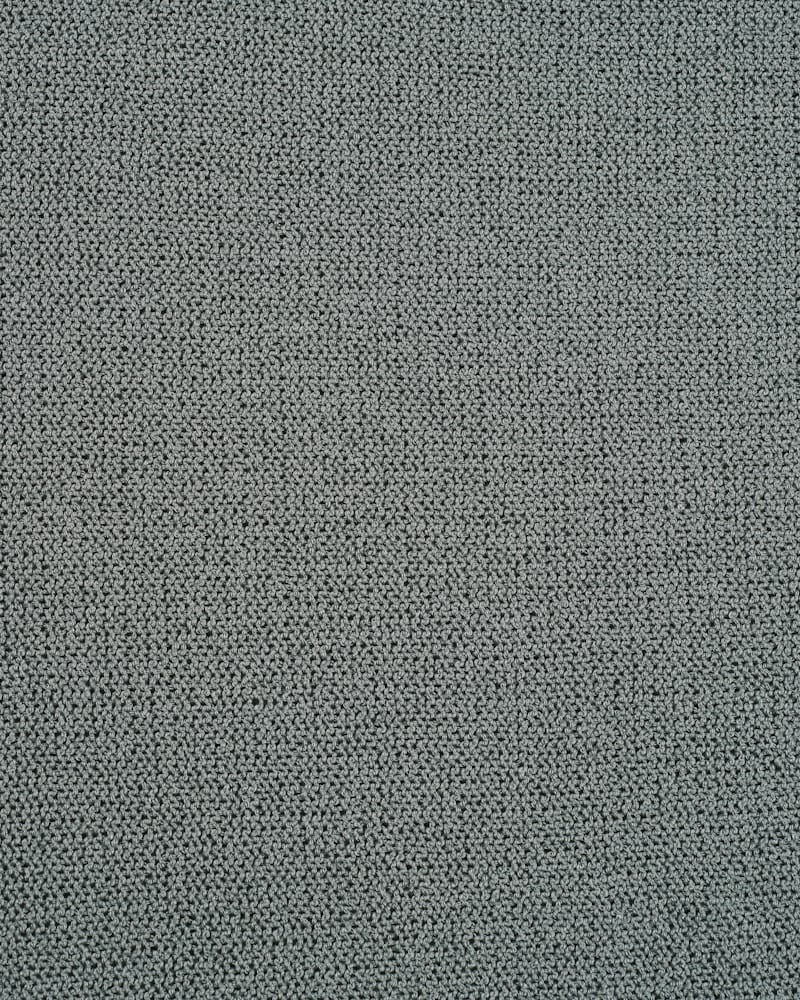 Close detail of a mid-tone woven blended fabric.