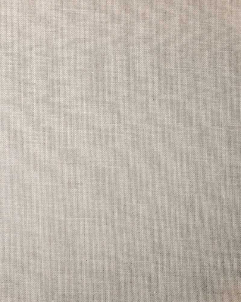 Close detail of an undyed natural-fibre weave.